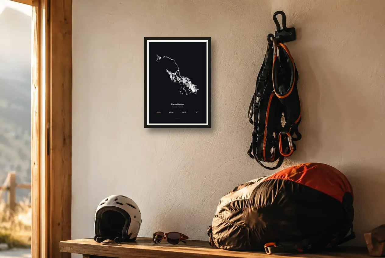 A dark Flight Art poster beside a pilot’s helmet, harness and packed wing.